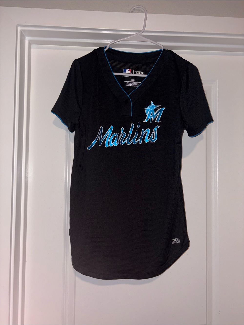 Genuine Merchandise Black Miami Marlins Jersey with Teal Accents